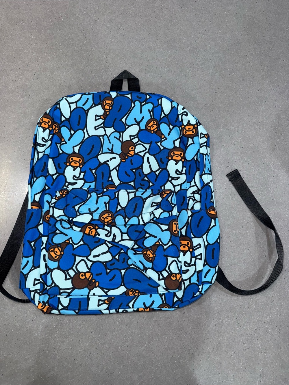 Bape Blue Graphic Backpack with Orange Ape Motif